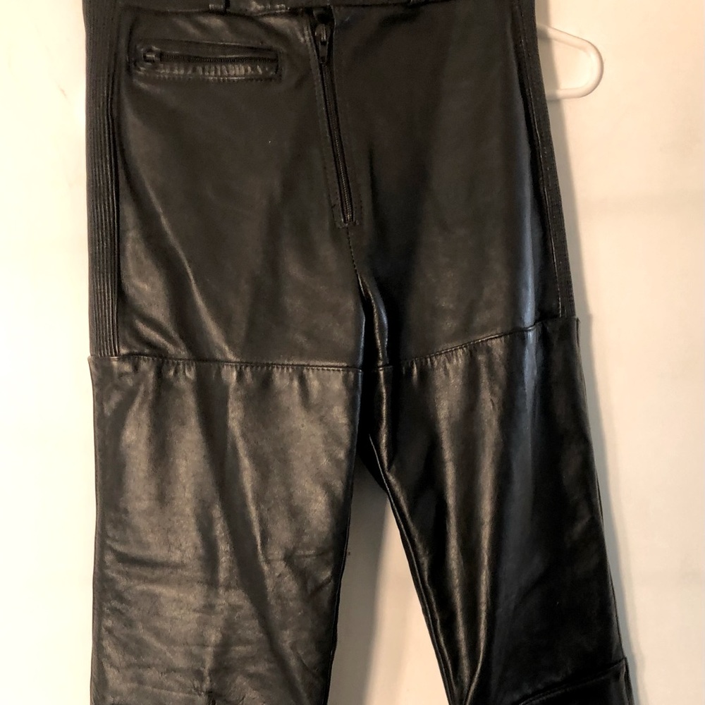 Racing biker woman leather pants